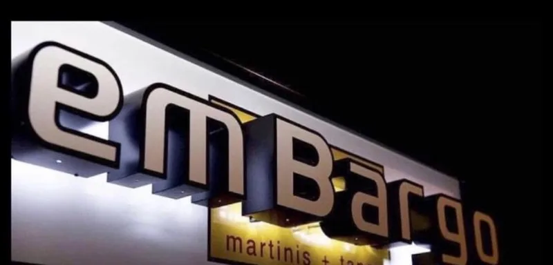Embargo's illuminated storefront sign on Main Street, Hyannis